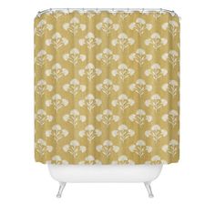 a yellow shower curtain with white flowers on the front and bottom, against a white background