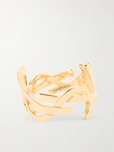 Designed by graphic artist Cassandre, SAINT LAURENT’s interlocking ‘YSL’ logo has been an icon of the house since its debut in 1961. This ring is cast from gold-tone metal and polished to a high shine. Cassandre Saint Laurent, Ysl Ring, Winter Work Wear, Ysl Logo, Cold Weather Boots, Rings Jewelry Fashion, Ballet Pumps, Finger Rings, Heeled Loafers