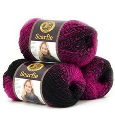 two skeins of yarn with the words scarrite written on them in black and pink