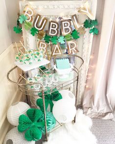 a bar cart filled with green and white desserts