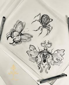 a drawing of three bugs and two butterflies on a sheet of paper next to a marker pen