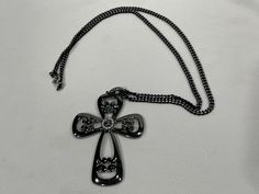 This Coventry open cross necklace in silver and gunmetal gray would be a statement piece.  Both the pendant and chain are in good condition, please preview all of the pictures.  cross - 2" wide x 2.75" in length necklace   - 24" long This is a vintage piece, gently aged and gently used.  Every effort is made to note issues in text and pictures.  Please preview all pictures, they are part of the description.   Our shop recycles packaging material where possible.  Shipping overages of more than $1 will be refunded with your package.  We welcome questions.  To see more vintage and antique pieces, please visit our store. https://www.etsy.com/shop/SaltGrassVintage Vintage Cross Necklace, Gray Necklace, Cool Piercings, Gunmetal Grey, Filigree Design, Cute Jewelry, Cross Necklace, Etsy Vintage, Silver Tone