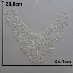 an image of a white lace collar on a gray background with measurements for the length