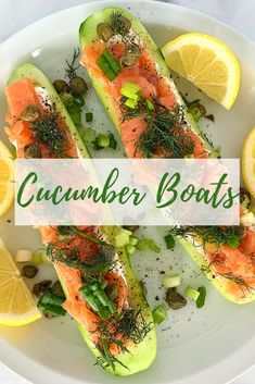 a white plate topped with cucumber boats covered in salmon