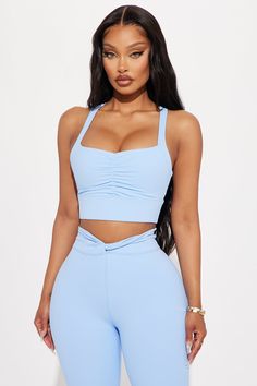 Available In Black And Light Blue. Sports Bra Square Neck Sleeveless Super Soft Strappy Detail Ruched Stretch Pair With "Ignite Super Soft Yoga Pant" Body: 77% Polyester 23% Spandex Inner Mesh: 82% Nylon 18% Spandex Imported | Blaze Super Soft Sports Bra in Light Blue size XL by Fashion Nova Sleeveless Elastane Sports Bra For Yoga, Blue Stretch Sleeveless Activewear, Blue Sleeveless Stretch Activewear, Sleeveless Elastane Sports Bra, Elastane Sports Bra, Sleeveless Elastane Top For Pilates, Blue Sleeveless Sports Bra For Gym, Blue Sleeveless Activewear With Built-in Bra, Casual Sleeveless Blue Sports Bra