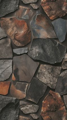 a stone wall made up of different colored rocks