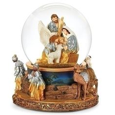 a snow globe with an image of the birth of jesus