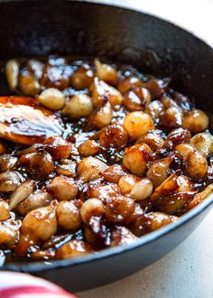 a pan filled with food sitting on top of a table