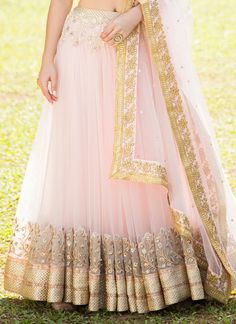 Cream and Light Pink Embroidered Net Lehenga features a dhupioni silk blouse, net lehenga with santoon inner and embroidered net dupatta. Zari, stone and sequins embellishments are present all over. Pastel Pink Lengha, Nude Lehenga, Trendy Bridal Lehenga, Lace Lehenga, Designer Bridal Lehenga Choli, Desi Wedding Dresses, Indian Bride Outfits, Net Lehenga