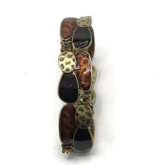 Brass tone with brown enamel stretch bracelet by Lia Sophia. Brown Metal Bracelet, Brown Metal Bangle Bracelet, Retro Brown Bracelets As Gift, Vintage Brown Metal Bracelets, Lia Sophia, Rhinestone Ring, Silver Spring, Rhinestone Earrings, Green Crystals