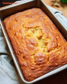 a loaf of bread sitting in a pan on top of a table