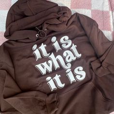 Unisex size hoodie in a brown color with a white, puff print graphic on the front. **Colors may show up differently on different screens Hoodie is: - 8 oz., 50% cotton, 50% polyester - Double-needle coverseaming on neck, armholes and waistband - Double-ply hood with grommets and matching drawcord Brown Graphic Print Sweatshirt For Streetwear, Brown Letter Print Hooded Top, Hooded Brown Tops With Letter Print, Brown Hooded Tops With Letter Print, Brown Hooded Top With Letter Print, Brown Graphic Print Hoodie Sweatshirt, Brown Letter Print Hoodie Sweatshirt, Brown Graphic Print Hoodie For Streetwear, Brown Hoodie Sweatshirt With Letter Print