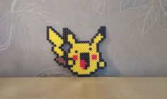 a piece of art made to look like a pokemon pikachu head on a table