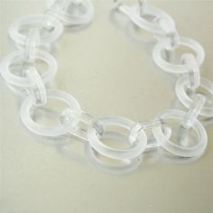 3feet Matte white acrylic circle chain, acrylic chain※ Description ※♥ Size: pls check the detail by the 2nd picture.♥ Color: matte clear white♥ Qty: 3feet(0.914meter)♥Material: acrylic♥ Useage: diy for bracelet, necklace or other craft items.♥ Package: well poly bag and wrapped by package material to prevent breakage and wearout.※ Shipping Time ※♥ The delivery time is around 9-22 working days.Sometimes the arriving time is possibly postponed because of the bad weather or customs matter.If that, Trendy Clear Jewelry With Chain, Modern White Jewelry With Chunky Chain, Modern White Chunky Chain Jewelry, Plastic Chain Link Jewelry For Gifts, Modern White Lucite Jewelry, Earring Chain, Circle Chain, White Circle, Clear White