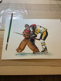 a watercolor drawing of two hockey players hugging each other on a wooden table next to a pencil and marker