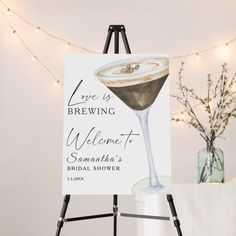 an easel with a sign on it that says, love is brewing welcome to savannah's bridal shower