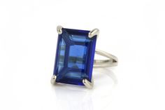 A custom-made blue ring, tailored in 14k gold filled setting and boasting a gorgeous Sapphire stone. A stylish gemstone ring that is perfect for any occasion - both for wearing and gifting. Sapphire is a September birthstone and is associated with healing and love. ☛ 𝒜𝐵𝒞 - Add Engraving - https://etsy.me/2ZSRjhu ☛ Ring size - Select the size you would like from the drop down menu ♥ Gemstone Type - Sapphire (Lab Created) ♥ Gemstone Size - 13x18mm ♥ Gemstone Cut - Faceted Rectangle ♥ Metal Type Rectangular Sapphire Ring, Fine Jewelry Blue Rectangular Sapphire Ring, Rectangular Sapphire Ring In Gold Setting, Modern Rectangular Sapphire Ring In 14k Gold, Rectangular Blue Sapphire Ring In 14k Gold, Emerald Cut Ring, Rectangle Ring, Gold Sapphire Ring, Vintage Cocktail Ring