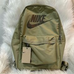 Olive Green Color With A Little Shimmer To It One Main Compartment And One Small Front Zippered Pocket. Two Side Pockets (One Zippered) Padded Adjustable Straps Made From Recycled Materials See Photos For Approximate Measurements Ynf 17542, 17544, 17543 Nike Casual Bags For Students, Nike Everyday Standard Backpack, Nike Student Backpack, Casual Nike Bags For Students, Nike Standard Student Backpack, Nike Bags With Zipper Closure For Back To School, Trendy Nike Travel Bag, Nike Casual Backpack For Students, Casual Nike Backpack For Students