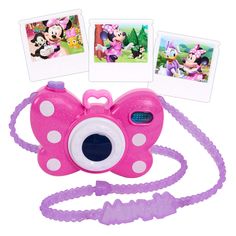 a pink and white camera with three pictures on the front, one has minnie mouse