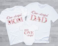 two shirts that say, one beautiful mom and one dad with pink flowers on them