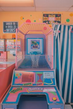 an arcade machine in a brightly colored room