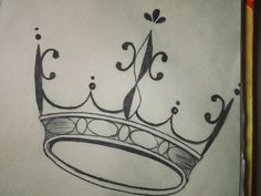 a drawing of a crown on top of a piece of paper