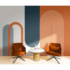 two chairs and a table in front of a wall with an abstract design on it