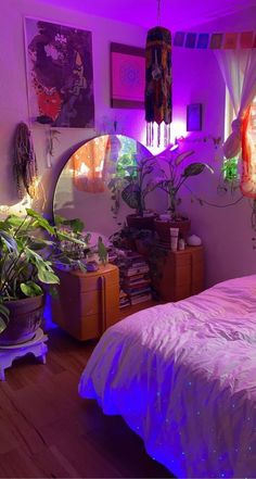 a bed room with a neatly made bed and plants