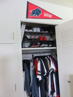 a white closet filled with lots of clothes