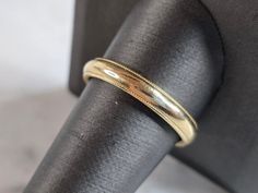 A MENS VINTAGE ESTATE 14K GOLD WEDDING BAND.   THE SIZE OF THE RING IS AN 11.0, AND WEIGHS 5.8g.  THE WIDTH OF THE BAND IS 1/8".  RING IS STAMPED "14K". ANY QUESTIONS PLEASE DO NOT HESITATE TO ASK.  BE SURE TO CHECK OUT SOME OF MY OTHER GREAT ITEMS UP FOR SALE. THANK YOU Classic Ceremonial Rings With Round Band, Classic Marriage Rings With Band Shape, Classic Yellow Gold Jewelry For Ceremonial Wedding, Timeless 14k Stamped Bands For Formal Occasions, Timeless 14k Gold Bands For Formal Occasions, Formal Yellow Gold Bands With Milgrain, Formal Yellow Gold Wedding Rings With Milgrain, Classic Gold Wedding Ring With Milgrain Detail, Classic Wedding Ring Stamped 14k