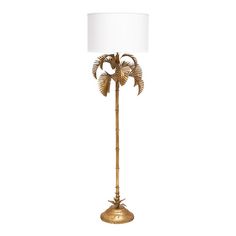 a gold palm tree lamp with a white shade on the top and bottom part of it