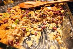 a casserole dish with beans and rice in it