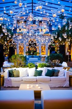 an image of a living room with lights on the ceiling and decorations hanging from the ceiling