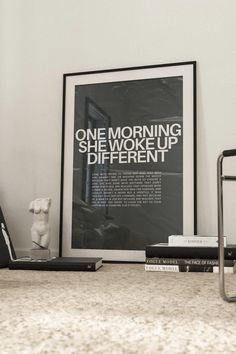 a black and white photo sitting on top of a table next to a book shelf