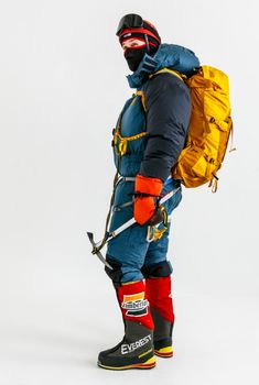 a man in ski gear is standing with his back to the camera