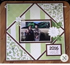 a scrapbook page with an image of two people in the center and flowers on it