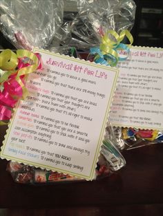 a basket filled with candies next to a sign that says survival gift for life