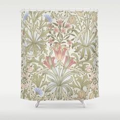 an ornate shower curtain with flowers and leaves on the outside, in pastel colors