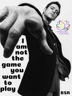 a man pointing at the camera with his hand in front of him that says, i am not the game you want to play