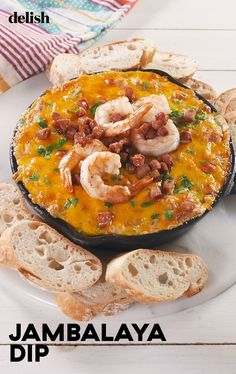 a white plate topped with bread and shrimp