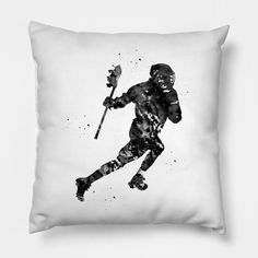 a black and white photo of a baseball player with a bat in his hand on a pillow