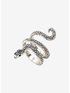 a silver snake ring with black and white snakes on it's sides, set against a