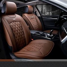 the interior of a car with tan leather and diamond stitching on the front seats