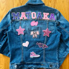 Show your camp pride with a made-to-order jean jacket. Perfect for those breezy nights by the lake. Please note: the pictures feature a few examples (Matoaka, Mattaponi, Micah) but I can personalize with any camp name, colors or activities. Casual Customizable Blue Outerwear, Customizable Casual Fall Outerwear, Teacher Denim Jacket Painted, Acrylic Paint On Jean Jacket, Painted Jean Jacket Sports, Pride Jean Jacket, Girls Jean Jacket With Patches, Summer Camp, Kids Jacket