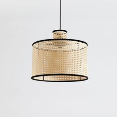 a light that is hanging from the ceiling with a white wall in the back ground