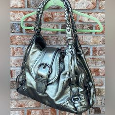 Coach Annie Gunmetal Metallic Leather Shoulder Bag 14236 Hard To Find! This Bag Has Never Been Used. Includes Dust Bag And Hang Tags. Beautiful Braided Leather Handles. Approximate Measurements Are Depth: 6" Height: 12" Width: 17" Strap Drop: 11". Comes From A Smoke Free Home. Thank You! Silver Metal Shoulder Bag For Everyday Use, Luxury Silver Shoulder Bag With Gold-tone Hardware, Silver Rectangular Shoulder Bag With Metal Hardware, Luxury Silver Satchel For Shopping, Designer Silver Shoulder Bag With Double Handle, Luxury Metal Shoulder Bag For Formal Occasions, Metallic Metal Evening Bag, Metallic Metal Evening Bags, Luxury Formal Metal Shoulder Bag