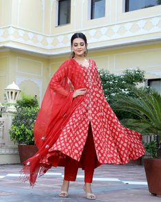 This is a one of a kind 3-piece set. It comes with cotton hand block print anarkali kurta with 32 kali and gota detailing on sleeves & neck has 3/4th flared sleeves & ankle length.The set also comes with handblock print pants with elasticated waistband and kota doria dupatta with gota patti detailing. Color-Red Kurta Fabric-Voil Cotton Bottom Fabric-Voil Cotton Dupatta Fabric-Kota Doria Work-Block Print & Gota Patti Detailing Neck-V Neck Sleeves-3/4th Flared Sleeves Washing Care-Dry Clean Only Red Long Sleeve Anarkali Set With Cutdana, Red Bandhani Print Palazzo Set For Festive Occasions, Festive Red Palazzo Set With Bandhani Print, Red Traditional Wear With Printed Motifs For Transitional Season, Red Chanderi Kurta With Printed Motifs, Red Sharara With Bandhani Print And Straight Kurta, Red Chanderi Anarkali Set For Festivals, Red Bandhani Print Palazzo Set For Festivals, Red Dupatta With Printed Motifs For Transitional Season