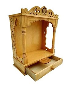 an ornate wooden stand with drawers on the bottom and side for shoes or other items