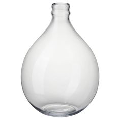 a clear glass vase sitting on top of a table