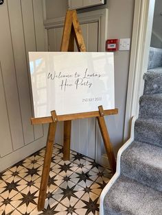 an easel with a sign that says welcome to james after party